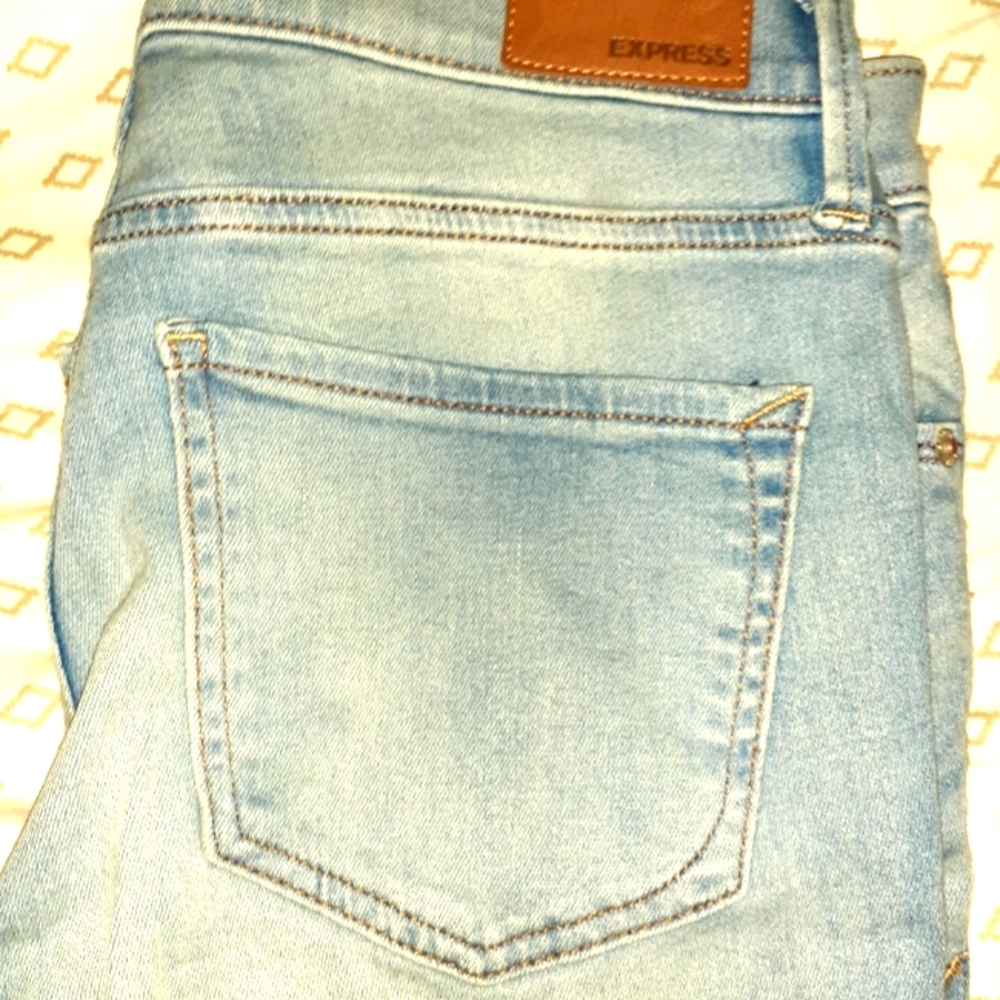 Express stretchy mid rise light wash jeggin